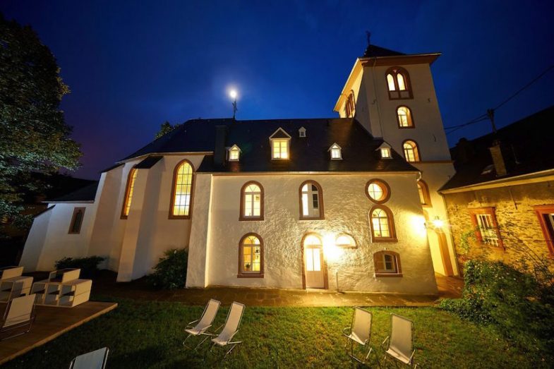exterior image of lit-up old church in Bernkastel-Wehlen